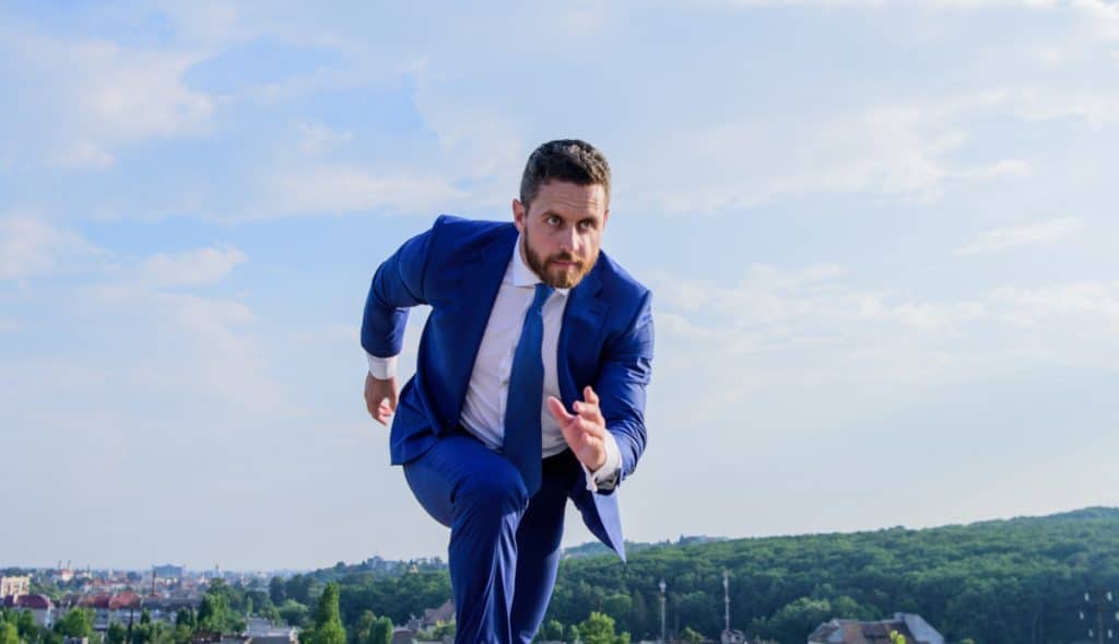 Agent running (hustle). Source: https://www.shutterstock.com/image-photo/towards-success-businessman-formal-suit-run-1153429567